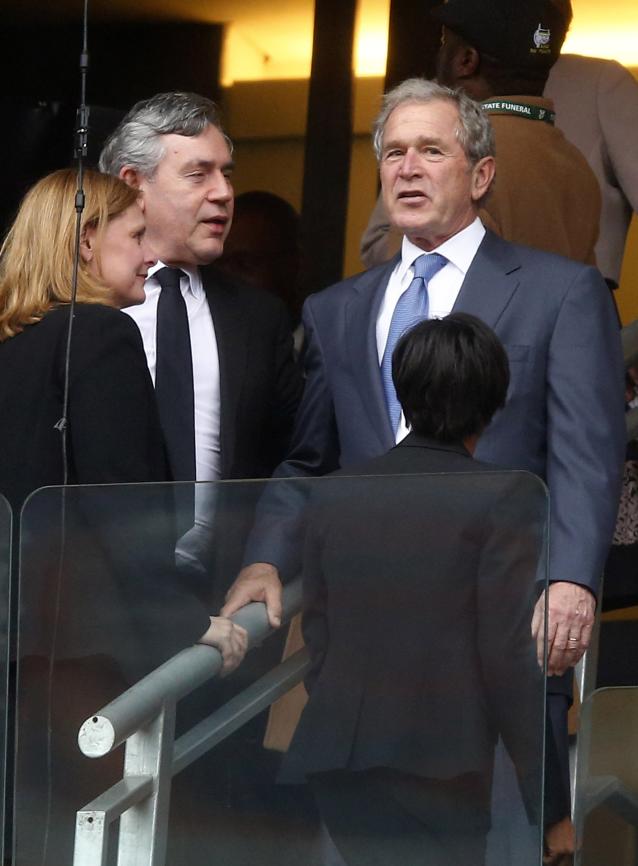 George W. Bush talks to Gordon Brown during memorial service for Nelson Mandela in Johannesburg