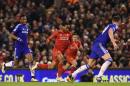 Liverpool's English midfielder Raheem Sterling (C) breaks through into the area to score an equalising goal during the English League Cup semi-final first leg football match between Liverpool and Chelsea in Liverpool, England, on January 20, 2015