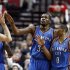 Oklahoma City Thunder's Kevin Durant, left, and Russell Westbrook celebrate with teammates during the second half of an NBA basketball game against the Portland Trail Blazers in Portland, Ore., Sunday, Jan. 13, 2013.  Durant score 33 points and Westbrook had 18 as they beat the Trail Blazers 87-83.(AP Photo/Don Ryan)