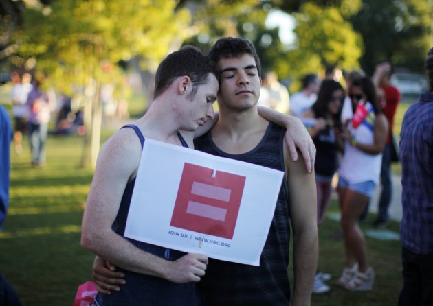 People hug at a rally in West Hollywood, California after the United States Supreme Court ruled on California's Proposition 8 and the federal DOMA
