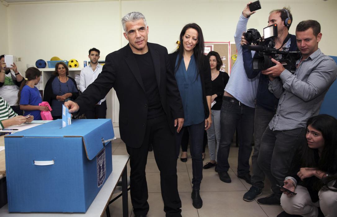 Yesh Atid leader Yair Lapid casts his ballot for the parliamentary election at a polling station in Tel Aviv