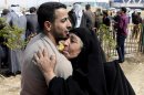 A former prisoner hugs his mother after being released from a prison in Baghdad, Iraq, Thursday, Feb. 28, 2013. Some 165 prisoners were released from the Iraqi Interior Ministry custody on Thursday. (AP Photo/ Karim Kadim)
