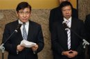 File photo of Sun Hung Kai Properties joint Chairmen and Managing Directors Thomas Kwok and Raymond Kwok speaking to reporters in Hong Kong