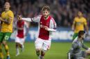 Ajax's Danish midfielder Lasse Schone celebrates scoring on November 6, 2013 at the Amsterdam Arena in Amsterdam