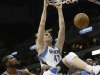 Minnesota Timberwolves' Andrei Kirilenko, center, of Russia, dunks as Oklahoma City Thunder's Kevin Durant, left, and Serge Ibaka, right, of Congo, watch during the first quarter of an NBA basketball game, Friday, March 29, 2013, in Minneapolis. (AP Photo/Jim Mone)