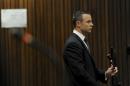 Oscar Pistorius stands in the dock at the high court in Pretoria, South Africa, Wednesday, May 14, 2014. The judge overseeing the murder trial of Pistorius on Wednesday ordered the double-amputee athlete to undergo psychiatric tests, meaning that the trial proceedings will be delayed. The court adjourned until May 21, 2014. (AP Photo/Werner Beukes, Pool)