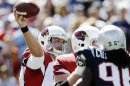 Arizona Cardinals quarterback Kevin Kolb, left, passes over New England Patriots linebacker Jermaine Cunningham (96) in the first quarter of an NFL football game, Sunday, Sept. 16, 2012, in Foxborough, Mass. (AP Photo/Elise Amendola)