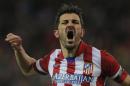 Atletico's David Villa complains to the referee during a Spanish La Liga soccer match between Atletico de Madrid and Real Sociedad at the Vicente Calderon stadium in Madrid, Spain, Sunday, Feb. 2, 2014. (AP Photo / Andres Kudacki)