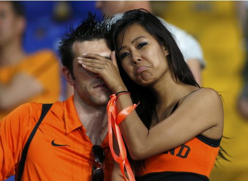 Netherlands' fans react at the end of their Group B Euro 2012 soccer match against Germany at the Metalist stadium in Kharkiv