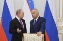 Russian President Putin speaks with Uzbekistan's President Karimov during a signing ceremony in Tashkent