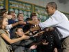 President Barack Obama greets the crowd at the Greensville County High School in Emporia, Va, Tuesday, Oct. 18, 2011. Obama is on a three-day bus tour promoting the American Jobs Act. (AP Photo/Susan Walsh)