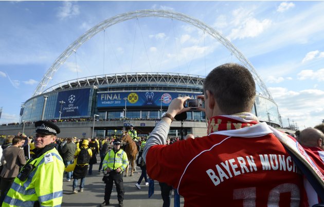 A Bayern fan stops to take a photograph before the Borussia Dortmund versus Bayern Munich Champions League Final soccer match at Wembley Stadium in London