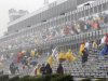 Fans leave the stands after the start of the NASCAR Sprint Cup Series auto race was postponed due to rain on Sunday, Aug. 5, 2012, at Pocono Raceway in Long Pond, Pa. (AP Photo/Mel Evans)