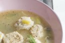 In this March 4, 2013 photo, spring vegetable soup with low-fat, high-flavor matzo balls is shown served in a bowl in Concord, N.H. (AP Photo/Matthew Mead)