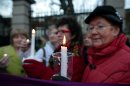 Relatives of victims of the Magdalene Laundries hold a candle lit vigil in solidarity with Justice for Magdalene Survivors and their families outside Leinster House, Dublin,Ireland, Tuesday, Feb. 19, 2013. The women expect to witness an apology by the Irish Prime Minister Enda Kenny on behalf of the people of Ireland for ignoring them and their treatment at the 10 laundries in the Republic between 1922 and 1996. The women will also hear details of how the State intends to assist them financially and in other ways as restitution. (AP Photo/Peter Morrison)