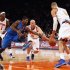 Dallas Mavericks' Mayo and New York Knicks' Kidd fight for a loose ball in front of Chandler during their NBA basketball game at Madison Square Garden in New York