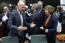 British Foreign Secretary Hague talks to EU foreign policy chief Ashton during an EU foreign ministers meeting in Brussels