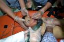 A boy receives treatment in Bab al-Hawa hospital