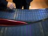 Company executives look at thin-film solar panels developed by MiaSole before a press conference held at the headquarters of Hanergy Group in Beijing, China, Wednesday, Jan. 9, 2013. Hanergy Group, the Chinese company that bought MiaSole, a California producer of thin-film solar panels, said it can make a success of the emerging technology where others have suffered huge losses. (AP Photo/Alexander F. Yuan)