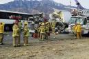 Tour bus hits truck, killing 13, injuring 31 in California