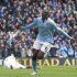 Manchester City's Yaya Toure, centre, celebrates after scoring against Chelsea during their English Premier League soccer match at The Etihad Stadium, Manchester, England, Sunday Feb. 24, 2013. (AP Photo/Jon Super)