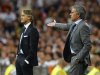 Real Madrid's coach Jose Mourinho reacts next to Manchester City's coach Roberto Mancini during their Champions League soccer match at the Santiago Bernabeu stadium in Madrid