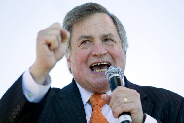 FILE - In this Sept. 12, 2010 file photo, political commentator Dick Morris speaks to the crowd during the "Gateway to November" rally hosted by the St. Louis Tea Party and Tea Party Patriots at the Gateway Arch in St. Louis. Morris acknowledged on Fox News Channel that some of the Republican presidential candidates that he talks about on the air have paid for advertisements in the newsletter he sends out to subscribers. Morris' statement on Fox Monday, Dec. 5, 2011, was the latest in a handful of episodes that laid bare close ties between the media and political world during the campaign season. (AP Photo/Whitney Curtis, file)