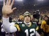 Green Bay Packers quarterback Aaron Rodgers waves to fans after defeating the Minnesota Vikings in their NFL NFC wildcard playoff football game in Green Bay