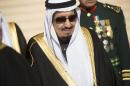 Saudi new King Salman stands at King Khalid International Airport in Riyadh on January 27, 2015