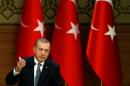 Turkish President Erdogan makes a speech during his meeting with mukhtars at the Presidential Palace in Ankara