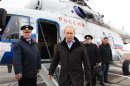 Russian President Vladimir Putin arrives at the town of Krymsk in the Krasnodar region