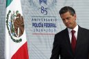 Mexico's President Enrique Pena Nieto attends a ceremony marking the anniversary of the federal police at the federal police intelligence center in Mexico City, Friday, July 12, 2013. (AP Photo/Marco Ugarte)