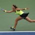 Azarenka of Belarus hits a return to Stosur of Australia during their women's singles quarterfinals match at the U.S. Open tennis tournament in New York