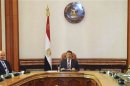 Egypt's President Mohamed Mursi attends a meeting with Defence Minister General Abdel Fattah al-Sisi, Vice President Mahmoud Mekky and members of the Supreme Council of the Armed Forces at the presidential palace in Cairo