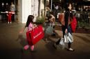 People shop at The Grove mall in Los Angeles