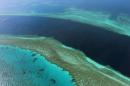 An aerial view of the Great Barrier Reef off the coast of the Whitsunday Islands, along the central coast of Queensland, on November 20, 2014