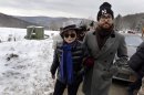 FILE - In this file photo of Jan. 17, 2013, Yoko Ono, left, and her son Sean Lennon visit a fracking site in Franklin Forks, Pa., during a bus tour of natural-gas drilling sites in northeastern Pennsylvania. Ono and Lennon have formed a group called 