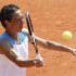 Schiavone of Italy returns the ball to Date-Krumm of Japan during the French Open tennis tournament at the Roland Garros stadium in Paris