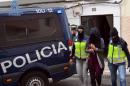 Spanish police arrest a woman suspected of collaborating with the Islamic State group on Spain's Canary island of Fuerteventura on December 8, 2015
