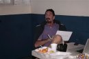 U.S. anti-virus software guru John McAfee uses a computer in a migrant shelter, where he is detained in Guatemala City