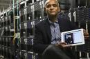 FILE - In this Thursday, Dec. 20, 2012, file photo, Chet Kanojia, founder and CEO of television-over-the-Internet service Aereo, Inc., shows a tablet displaying his company's technology, in New York. After the Supreme Court's ruling against the company, Aereo is now using the high court's own language to force broadcasters to treat it just like other cable TV companies. In Aereo's view, that means broadcasters must license its signals to Aereo under a 1976 copyright law. (AP Photo/Bebeto Matthews, File)