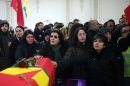 Kurdish people pay tribute to the three activists during a memorial ceremony, in Villiers le Bel, north of Paris, Tuesday, Jan. 15, 2013, before their bodies are sent to Turkey for burial. Three Kurdish women were shot dead at a pro-Kurdish center in Paris on Thursday Jan. 10, in what the French interior minister called an execution. (AP Photo/Thibault Camus)