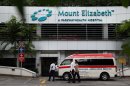 An ambulance is parked outside the Mount Elizabeth Hospital in Singapore Thursday, Dec. 27, 2012. A young woman who was gang-raped and assaulted on a moving bus in the Indian capital was flown Thursday to the Singapore hospital for treatment of severe internal injuries that could last several weeks, officials said. (AP Photo/Wong Maye-E)