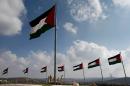 Palestinian flags flutter on a square in the city of Rawabi, just north of Ramallah in the West Bank, on September 5, 2014