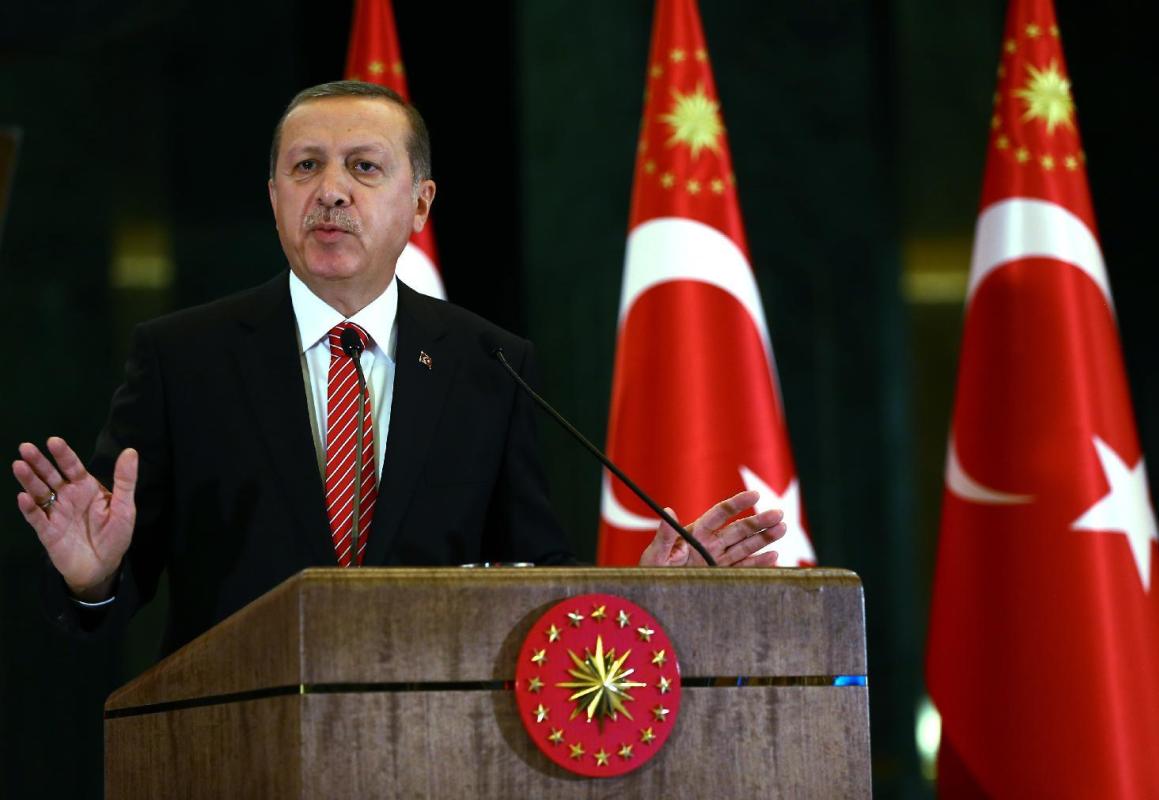 Turkish President Recep Tayyip Erdogan speaks during a meeting at the presidential palace in Ankara, Turkey, Tuesday, Nov. 24, 2015. In a long-feared escalation of tensions between Russia and NATO as well as the Syrian conflict, Turkey on Tuesday shot down a Russian warplane that it claims had crossed into its airspace during a sortie against rebels in Syria. Turkey has vowed to support the Syrian Turkmen and Erdogan on Tuesday criticized Russian actions in the Turkmen regions, saying there were no Islamic State group fighters in the area. (AP Photo/Kayhan Ozer, Presidential Press Service, Pool )