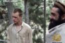 Still image provided by IntelCenter shows the Taliban associated video production group Manba al-Jihad's December 7, 2010 release of someone that appears to be US soldier Bowe Bergdahl (L)
