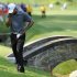 Tiger Woods pauses as he waits to hit out of the rough on the 11th hole during the first round of the AT&T National golf tournament at Congressional Country Club in Bethesda, Md., Thursday, June 28, 2012. (AP Photo/Nick Wass)