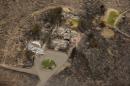 This aerial photo shows structures which were destroyed by wildfires near Pateros, Wash. on Thursday, July 24, 2014. Fire spokesman Pete Buist says the biggest wildfire in the state's history remains at 52 percent contained on Thursday. However, the weather forecast calls for hot and dry conditions to return over the next few days. (AP Photo)