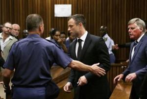South African Olympic and Paralympic track star Pistorius is led to holding cells after he was sentenced at the North Gauteng High Court in Pretoria
