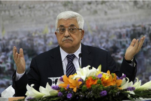 Palestinian President Abbas gestures during a news conference in Ramallah